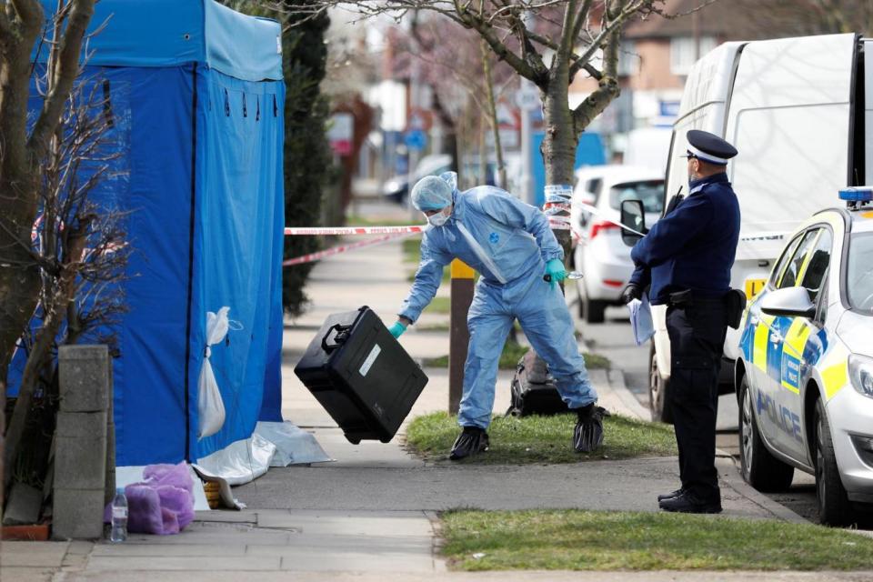 Forensics investigators work at the home of Nikolai Glushkov (REUTERS)