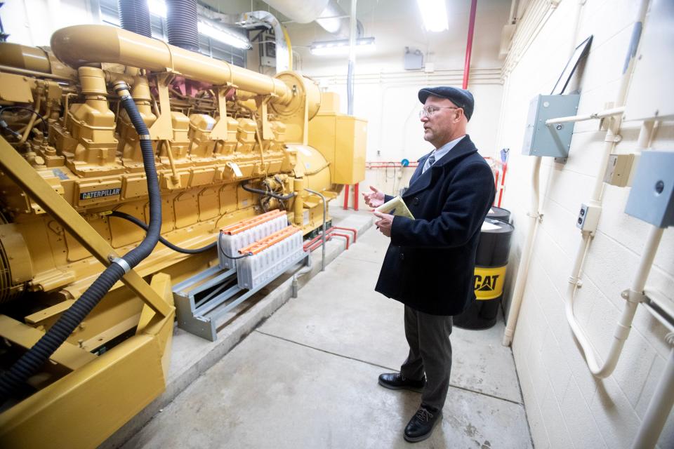 Tyler Converse, superintendent of the Canton Water Department, talks about a 2,500-horsepower diesel engine for plant power backup at the city's Sugar Creek Water Treatment Plant in Sugarcreek Township in Tuscarawas County.