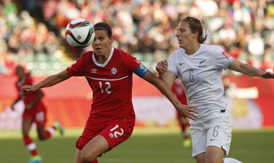 EDMONTON, AB - JUNE 11: Christine Sinclair #12 of Canada keeps the ball from Rebekah Stott #6 of New Zealand during the FIFA Women&#39;s World Cup Canada Group A match between Canada and New Zealand at Commonwealth Stadium on June 11, 2015 in Edmonton, Alberta, Canada. (Photo by Todd Korol/Getty Images)