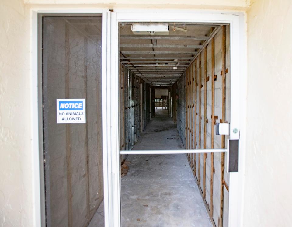 Damage from Hurricane Ian remains visible on the ground floor at the Vanderbilt III condominiums in Naples on Friday, Dec. 1, 2023. The glass on the entrance to the floor is still missing.