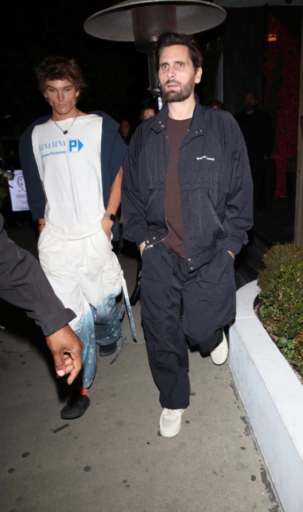 Scott Disick (right) enjoys a night out with friends, including Jordan Barrett, as they leave dinner at Catch Steak in Los Angeles in 2024. STAR INFLUX LA / BACKGRID