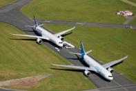 An Airbus A350-1000 and an Airbus A330 NEO are seen during the 53rd International Paris Air Show at Le Bourget Airport near Paris