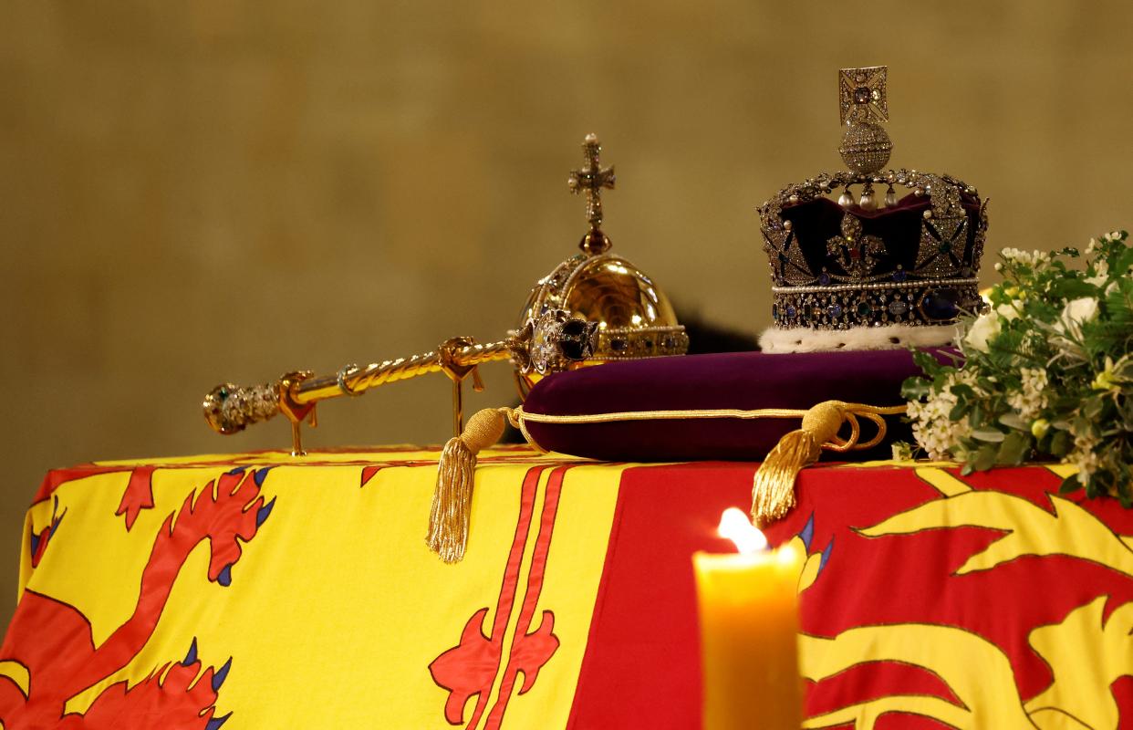 The Imperial State Crown lays atop the coffin of Queen Elizabeth II as it Lies in State inside Westminster Hall, at the Palace of Westminster in London on September 15, 2022. - Queen Elizabeth II will lie in state in Westminster Hall inside the Palace of Westminster, until 0530 GMT on September 19, a few hours before her funeral, with huge queues expected to file past her coffin to pay their respects. (Photo by Odd ANDERSEN / various sources / AFP) (Photo by ODD ANDERSEN/POOL/AFP via Getty Images)