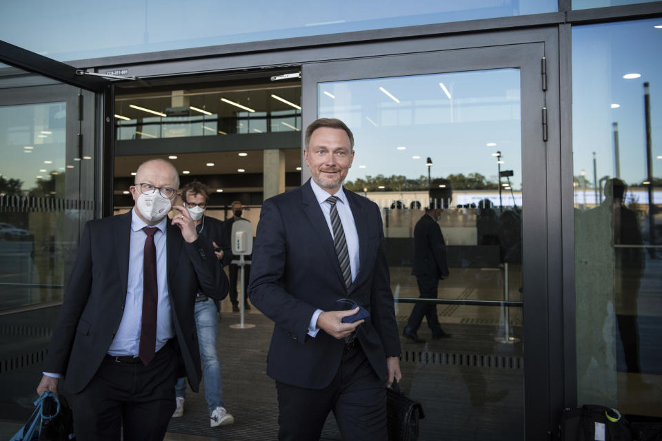 Christian Lindner, chairman of the German Liberal Party (FDP), leaves after exploratory talks with the SPD, FDP and Green party in Berlin, Thursday, Oct. 7, 2021. (AP Photo/Steffi Loos)