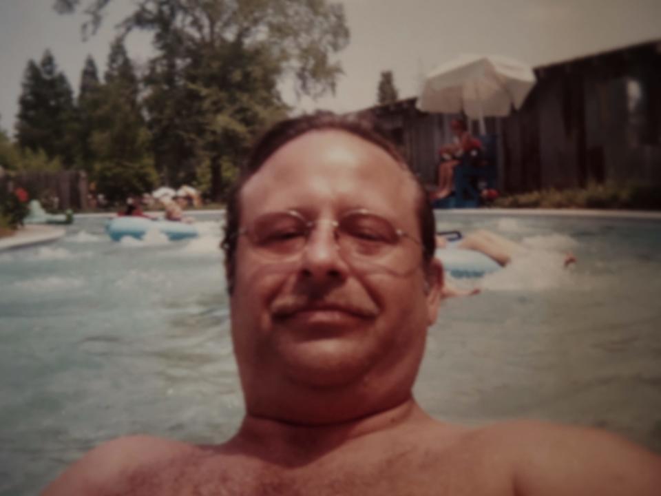 Burt Templet, who was shot to death by his son, Anthony, is shown without a shirt while swimming in a pool.