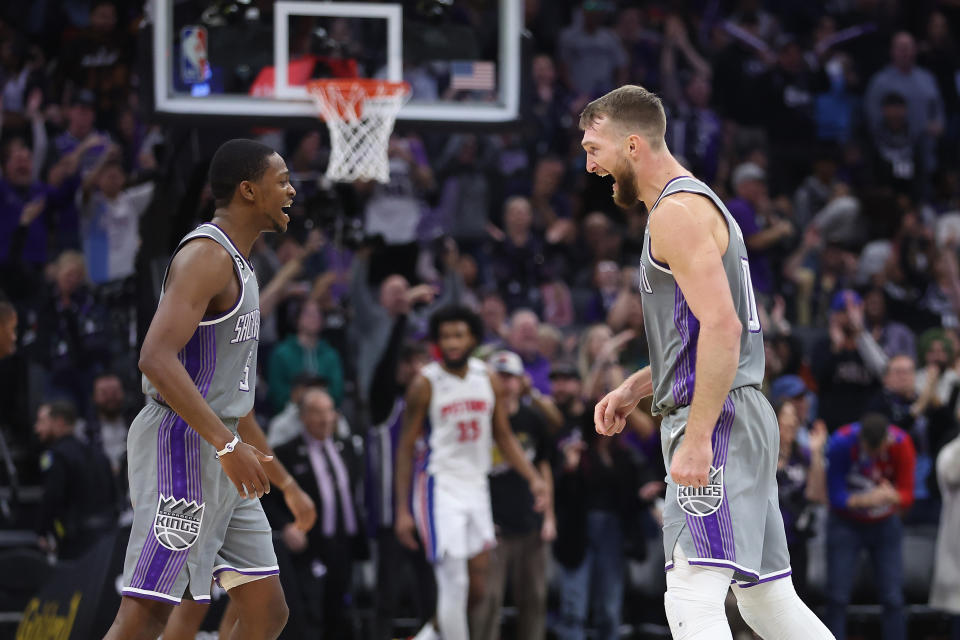 SACRAMENTO, CALIFORNIA - NOVEMBER 20: De&#39;Aaron Fox #5 and Domantas Sabonis #10 of the Sacramento Kings celebrate after a three-point basket in the fourth quarter against the Detroit Pistons at Golden 1 Center on November 20, 2022 in Sacramento, California. NOTE TO USER: User expressly acknowledges and agrees that, by downloading and/or using this photograph, User is consenting to the terms and conditions of the Getty Images License Agreement. (Photo by Lachlan Cunningham/Getty Images)