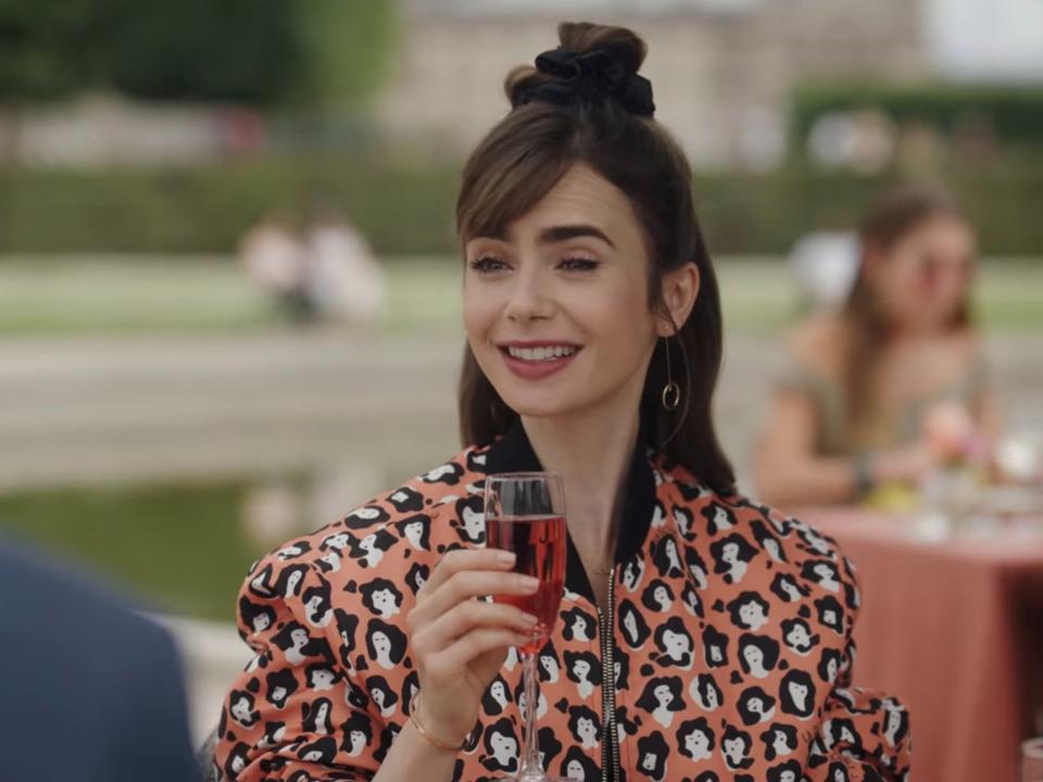 Emily (Lily Collins) tries a Kir Royale for the first time in season three of "Emily in Paris."