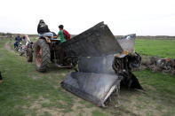 <p>A tractor pulls a part of a missilein Quneitra, Syria, Feb. 10, 2018. (Photo: Alaa al Faqir/Reuters) </p>