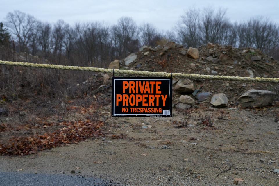 Property at 175 Post Rd. in Warwick is roped off and posted, blocking public access to the Pawtuxet River Trail. The City of Warwick is trying to work out a compromise that would allow the owners to develop the property while preserving trail access.