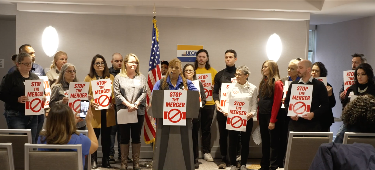 Port Orchard Safeway worker and UFCW Local 3000 member Naomi Oligario, front, speaks out against a merger of Albertsons and Kroger at a press conference in Washington, D.C., on Tuesday ahead of a hearing hosted by the Senate Judiciary Subcommittee on Competition Policy, Antitrust, and Consumer Rights.