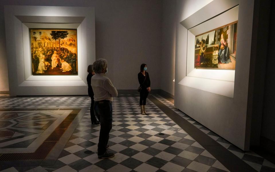 Leonardo Da Vinci may only have painted part of The Annunciation, right - AP Photo/Andrew Medichini