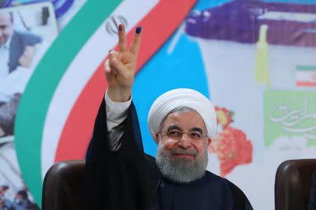 FILE PHOTO: Iran's President Hassan Rouhani gestures as he registers to run for a second four-year term in the May election, in Tehran, Iran, April 14, 2017. President.ir/Handout/File Photo via REUTERS