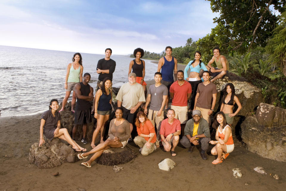 The castaways pose on the beach