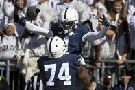 Penn State wide receiver KeAndre Lambert-Smith (1) celebrates with offensive lineman Olumuyiwa Fashanu (74) after scoring a touchdown against Ohio State during the first half of an NCAA college football game, Saturday, Oct. 29, 2022, in State College, Pa. (AP Photo/Barry Reeger)