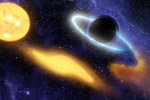 An artist's concept shows a black hole eating material from a nearby star. Researchers say its possible dark matter swirling around a black hole could radiate gamma rays that could be seen by telescopes.