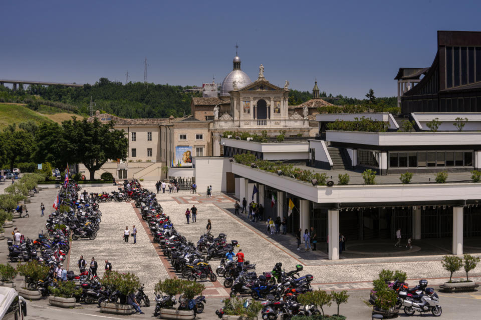 The esplanade of the St. Gabriele dell' Addolorata sanctuary in Isola del Gran Sasso near Teramo in central Italy is filled with motorcycles for an annual bikers pilgrimage, Sunday, June 18, 2023. (AP Photo/Domenico Stinellis)