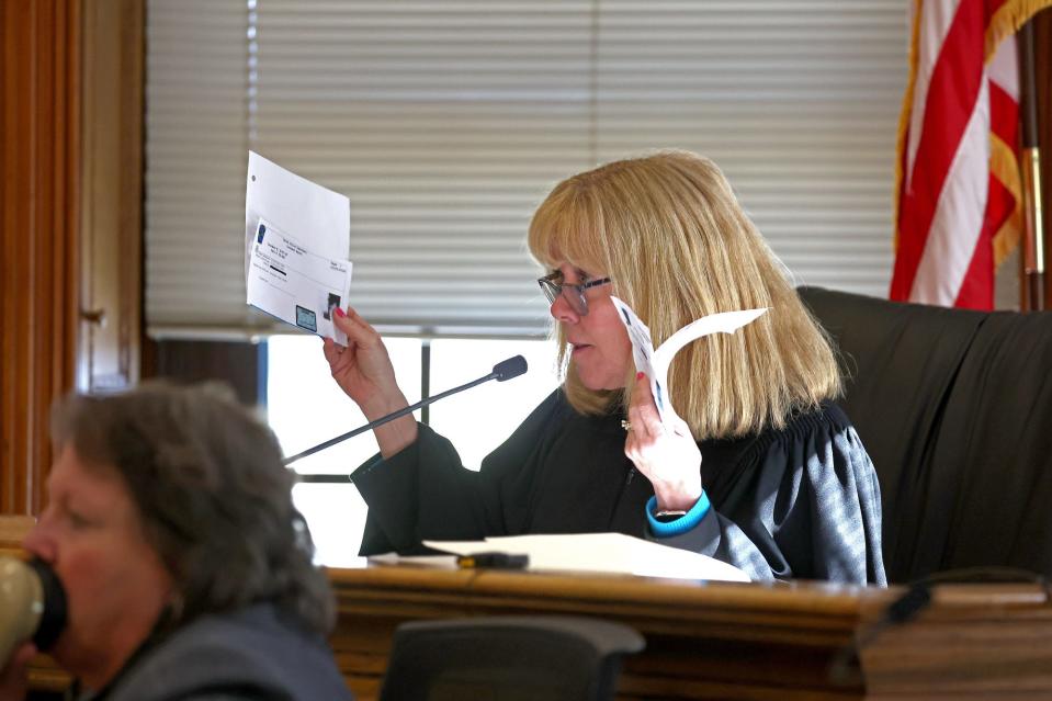 Judge Beverly Cannone holds up evidence during Karen Read's murder trial on Tuesday.