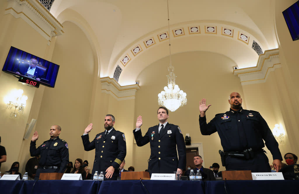 Dunn, right, is sworn in with other law enforcement members prior to testifying before the House Select Committee investigating the January 6 attack on the U.S. Capitol on July 27, 2021.<span class="copyright">Chip Somodevilla—Getty Images</span>