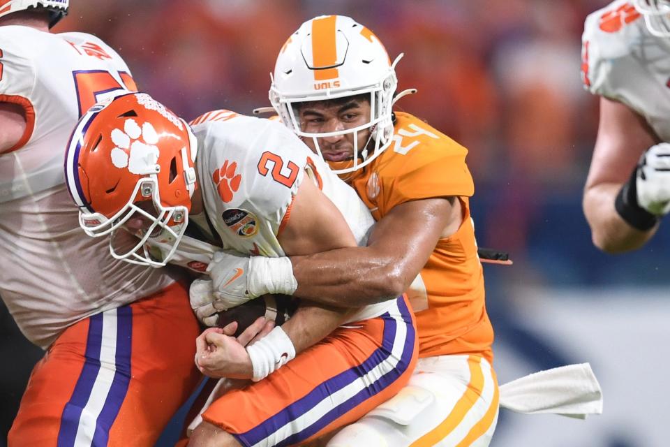 Tennessee linebacker Aaron Beasley (24) tackles Clemson quarterback Cade Klubnik (2) during the first half of the Orange Bowl game between the Tennessee Vols and Clemson Tigers at Hard Rock Stadium in Miami Gardens, Fla. on Friday, Dec. 30, 2022.