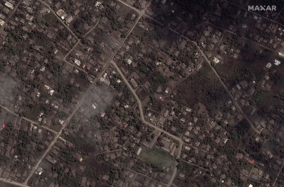 This satellite image provided by Maxar Technologies shows ash covered homes and buildings in Tonga Tuesday, Jan. 18, 2022 after a huge undersea volcanic eruption. (Satellite image ©2022 Maxar Technologies via AP)