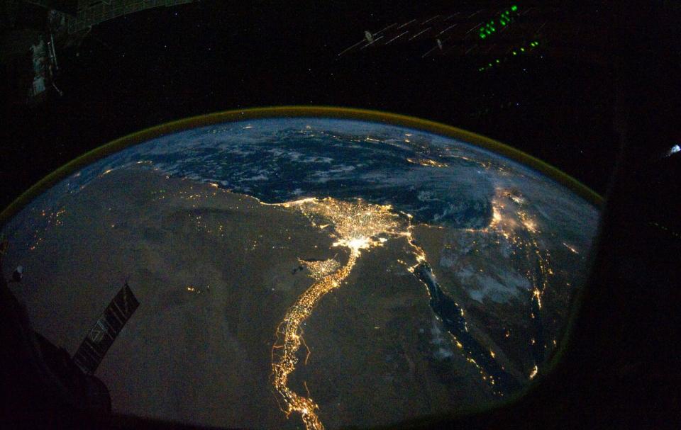 From 220 miles above Earth, one of the Expedition 25 crew members on the International Space Station took this night time photo featuring the bright lights of Cairo and Alexandria, Egypt on the Mediterranean coast. The Nile River and its delta stand out clearly as well. On the horizon, the airglow of the atmosphere is seen across the Mediterranean. The Sinai Peninsula, at right, is outlined wit