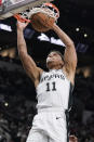 San Antonio Spurs' Bryn Forbes dunks during the second half of an NBA preseason basketball game against the New Orleans Pelicans, Sunday, Oct. 13, 2019, in San Antonio. (AP Photo/Darren Abate)