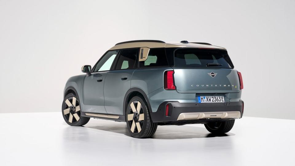 2025 mini cooper countryman electric in light blue with a cream and black interior