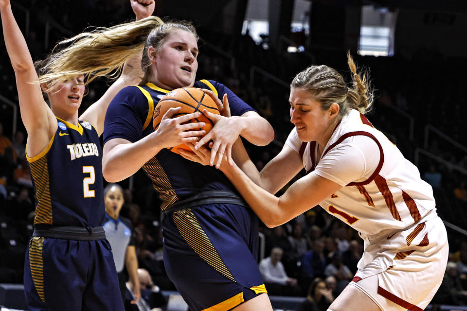 Toledo forward Jessica Cook (34) battles for the ball with Iowa State guard Lexi Donarski, right, in the second half of a first-round college basketball game in the NCAA Tournament, Saturday, March 18, 2023, in Knoxville, Tenn. (AP Photo/Wade Payne)