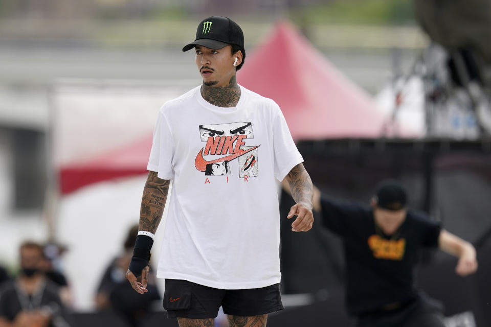 In this May 22, 2021, photo, Nyjah Huston, of the United States, practices during an Olympic qualifying skateboard event at Lauridsen Skatepark in Des Moines, Iowa. Where some skateboarders might be reluctant to move so boldly into the gargantuan realm of the Olympics, Huston is more than glad to latch on onto this monster. Tokyo might be the place where people outside the sport finally get a glimpse of one of the most interesting athletes around. (AP Photo/Charlie Neibergall)