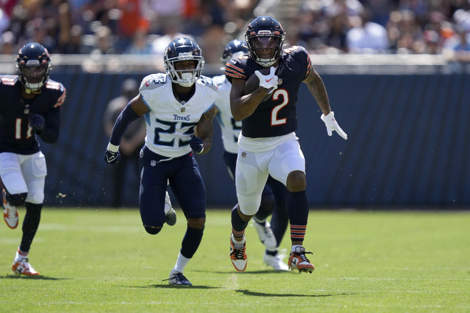 Chicago Bears wide receiver DJ Moore runs after a catch for a touchdown against the Tennessee Titans during the first half of an NFL preseason football game, Saturday, Aug. 12, 2023, in Chicago. (AP Photo/Charles Rex Arbogast)