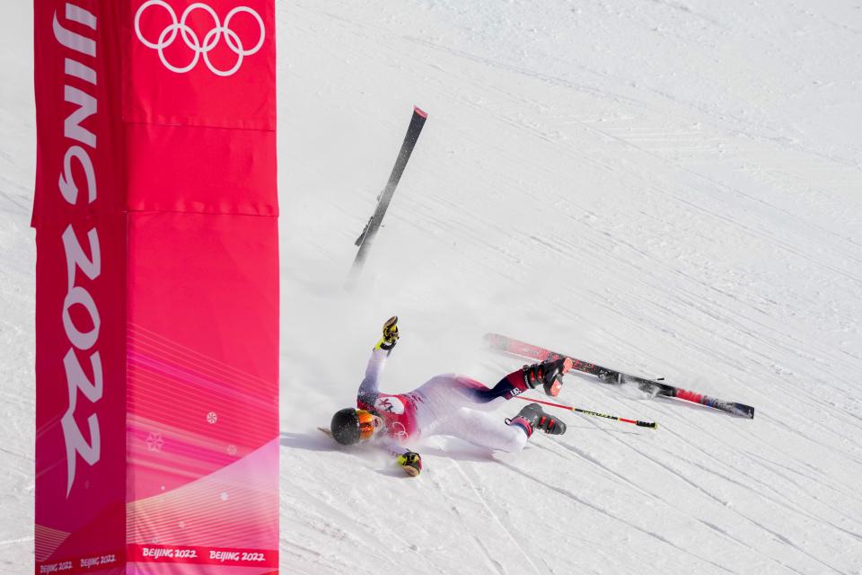 Nina O'Brien of United States falls during the women's giant slalom at the 2022 Winter Olympics, Monday, Feb. 7, 2022, in the Yanqing district of Beijing.(AP Photo/Mark Schiefelbein)