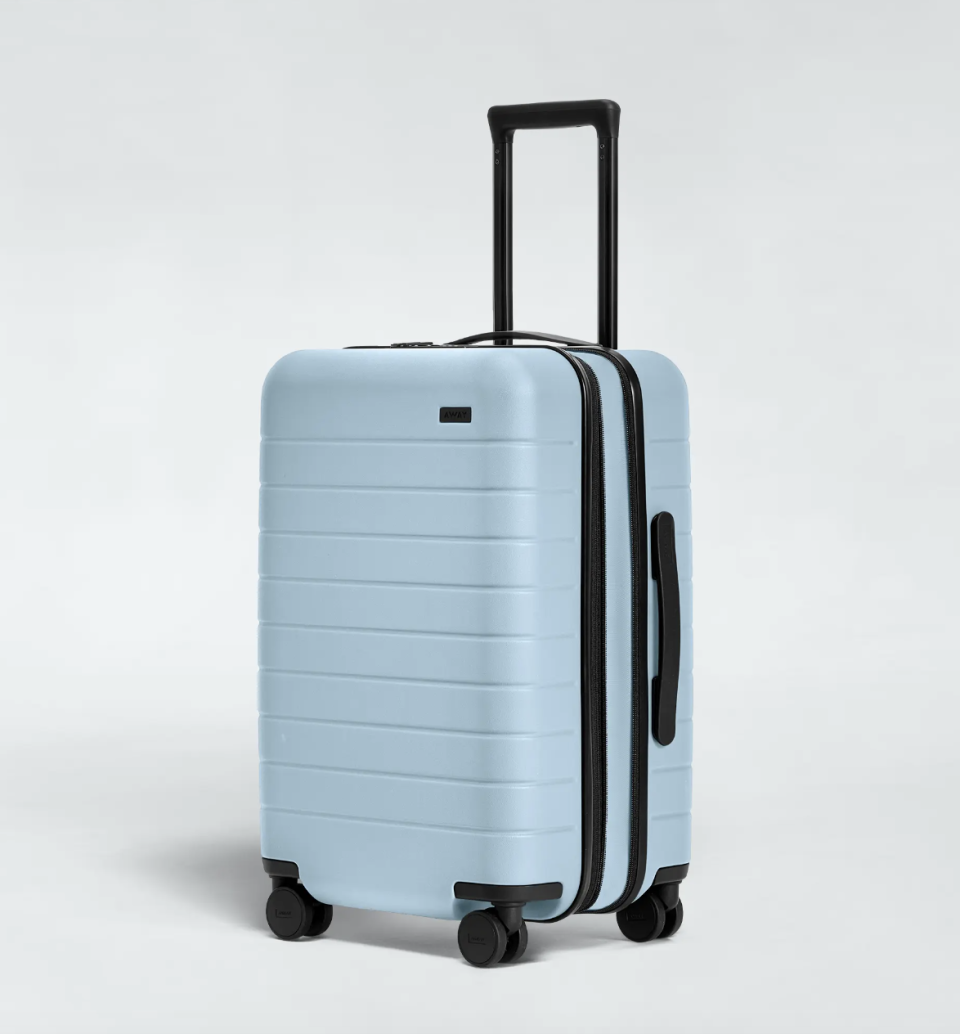 The Carry-On Flex carry on suitcase in sky (photo via Away)