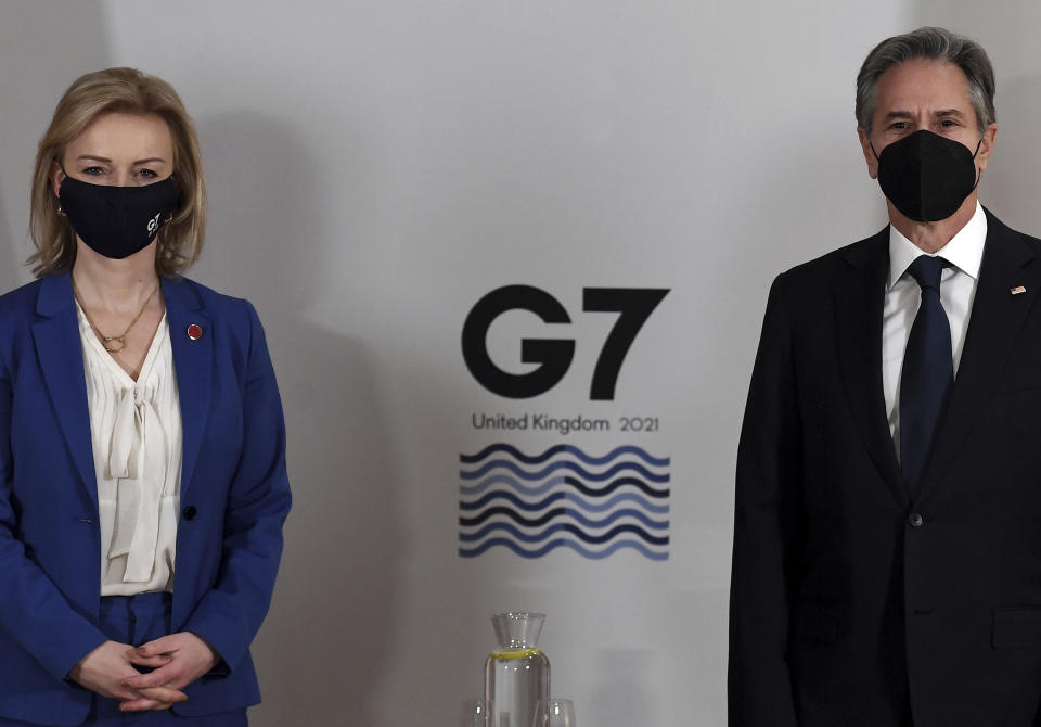 Britain's Foreign Secretary Liz Truss, left, and US Secretary of State Antony Blinken, wearing face coverings to combat the spread of the coronavirus, pose for a photograph before a bilateral meeting ahead of the G7 foreign ministers summit in Liverpool, England, Friday, Dec. 10, 2021. - Blinken arrived in Britain for a G7 ministers' meeting before visiting Indonesia, Malaysia and Thailand. (Olivier Douliery/Pool Photo via AP)