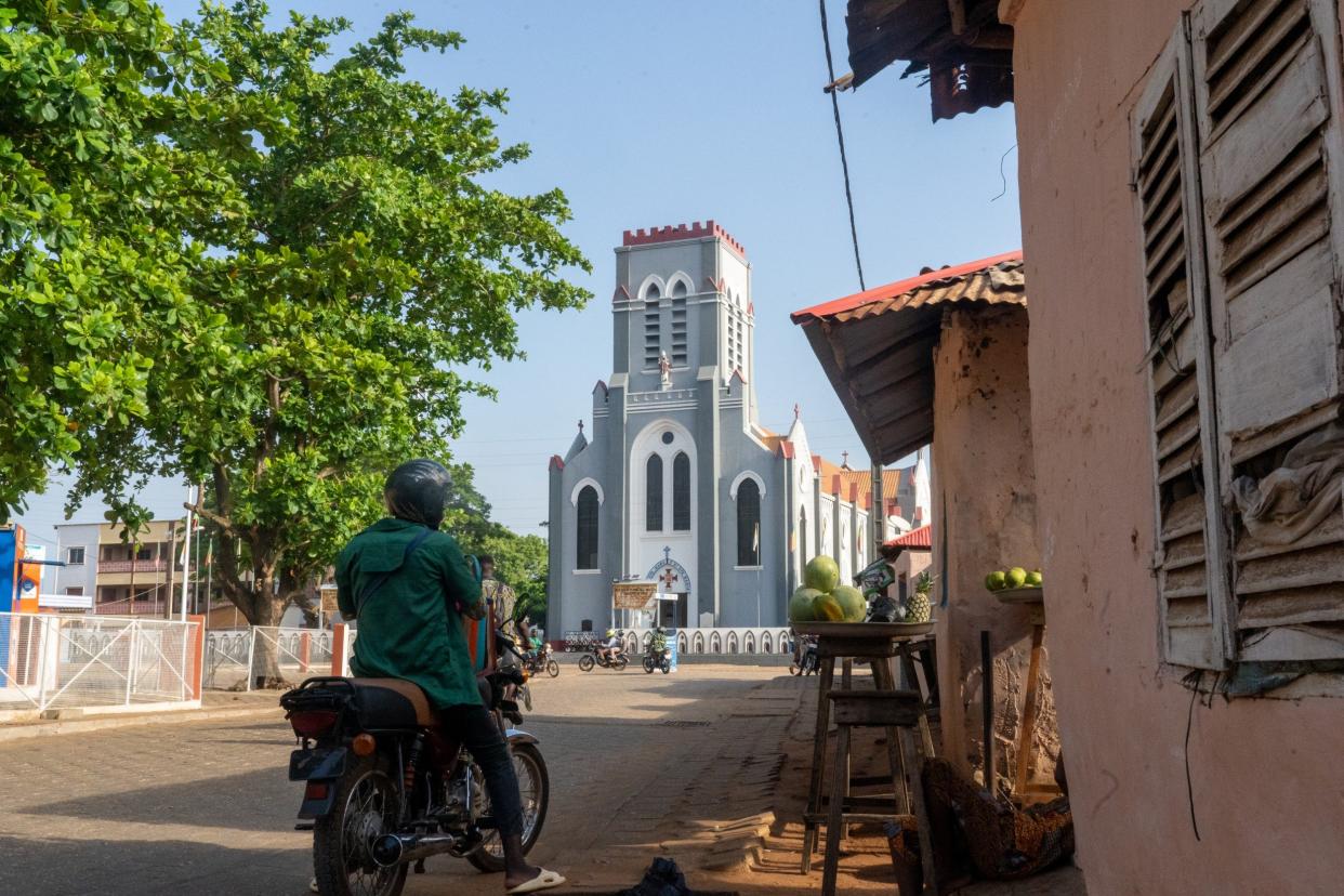 The Basilica of the Immaculate Conception in Ouidah stands less than 100 metres away from the Temple of Pythons. Benin's Christian and Voodoo communities live in relative harmony