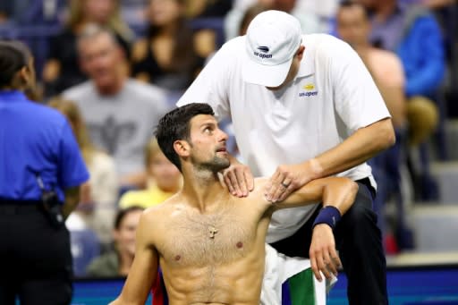 World number one Novak Djokovic is treated for left shoulder pain during his three-set victory Wednesday in the second round of the US Open