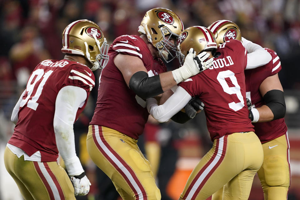 San Francisco 49ers kicker Robbie Gould (9) is congratulated by teammates after kicking the game-winning field goal against the Los Angeles Rams during the second half of an NFL football game in Santa Clara, Calif., Saturday, Dec. 21, 2019. (AP Photo/Tony Avelar)