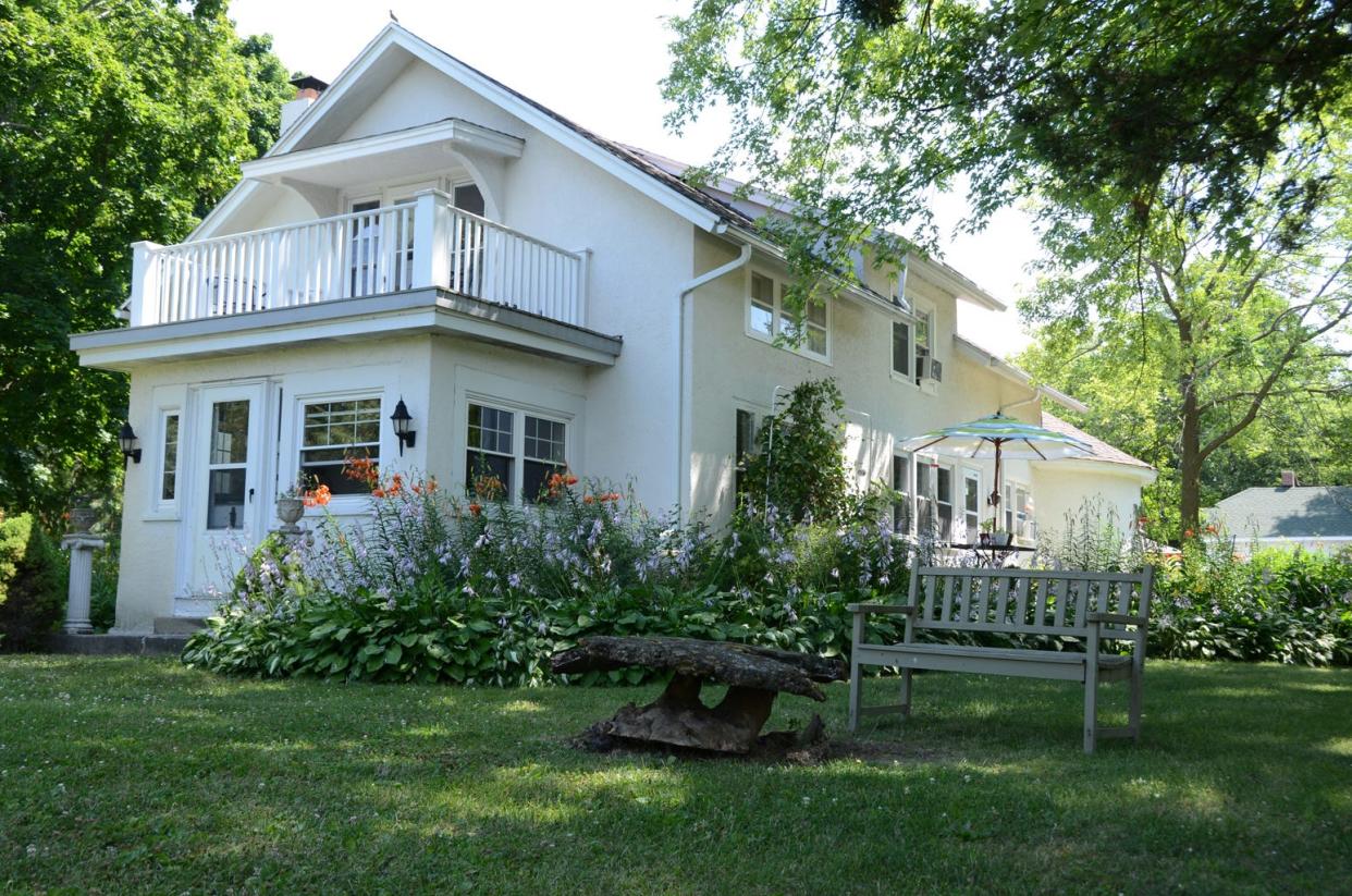 Perennial gardens surround Ye Olde Manor House in Elkhorn. The bed and breakfast has eight rooms for rent, including one with a private balcony overlooking the gardens.