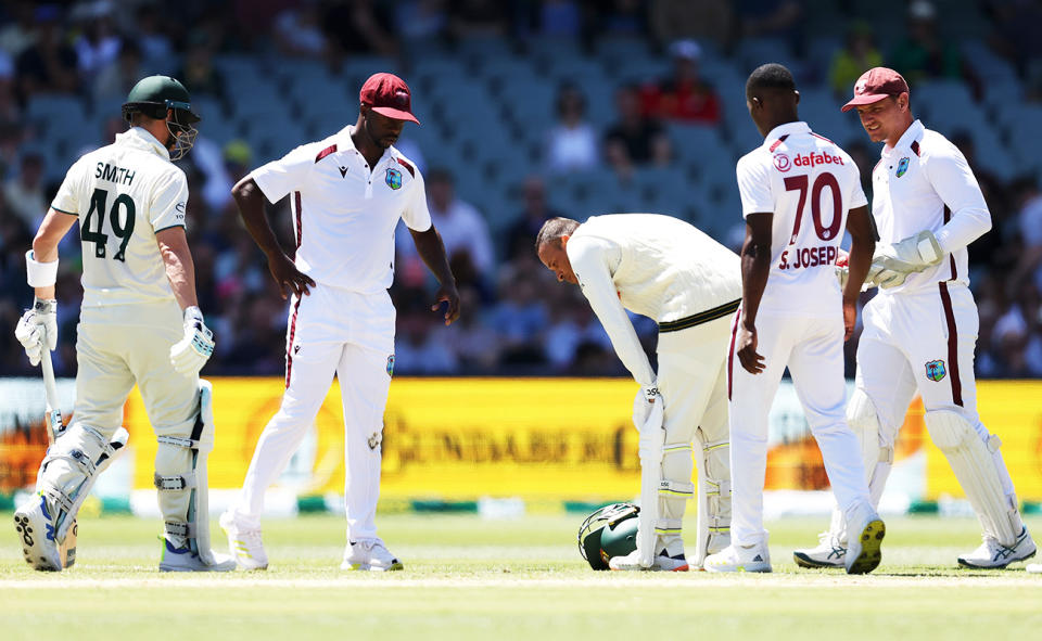 Usman Khawaja, pictured here after copping a nasty blow off the bowling of Shamar Joseph.