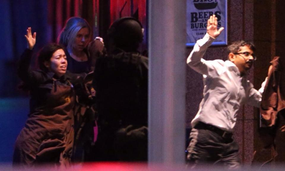 Hostages flee the Lindt cafe at the end of the Sydney siege