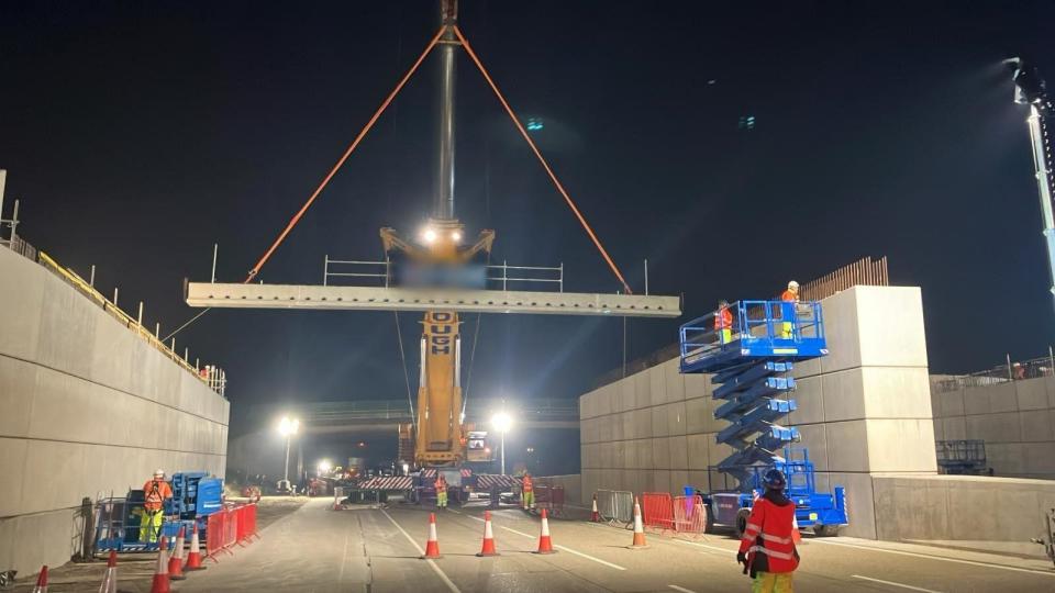 A beam being lifted by a crane