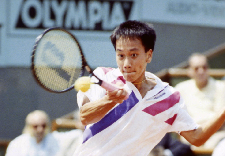 FILE - In this June 9, 1989, file photo, Michael Chang makes a return during his match against Ivan Lendl in the men's singles final at the French Open tennis championships in Paris. Chang would go on to become the youngest male champion at any Slam, beating Lendl 4-6, 4-6, 6-3, 6-3, 6-3. (AP Photo/File)