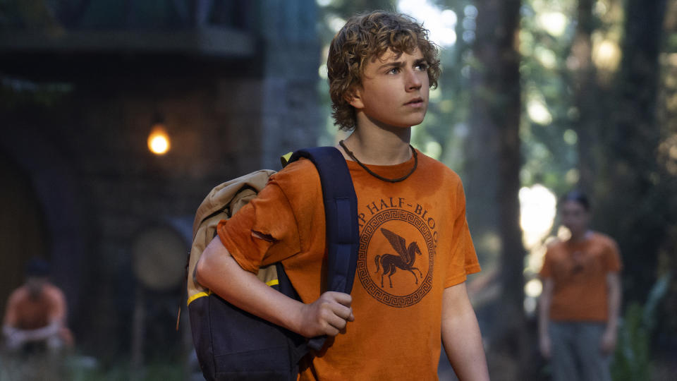 Percy walks into a forest camp in Percy Jackson and the Olympians' Disney Plus series