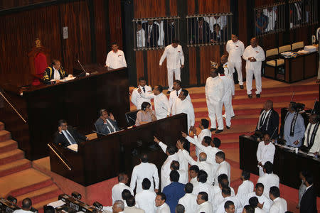 Sri Lanka's parliament members argue in front of Speaker of the Parliament Karu Jayasuriya during the parliament session in Colombo, Sri Lanka November 14, 2018. REUTERS/Stringer