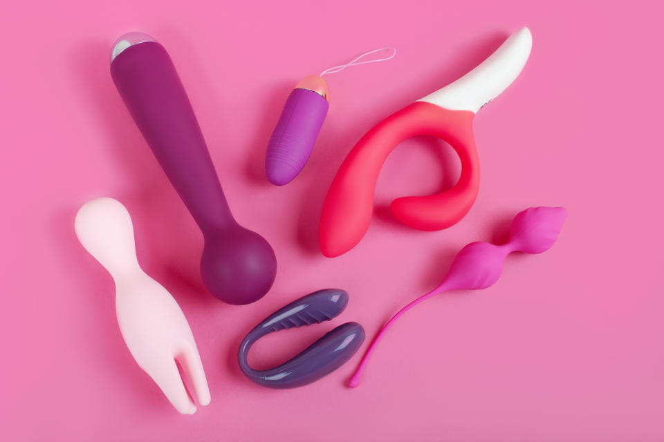 Silicone sex toys on a pink background. 