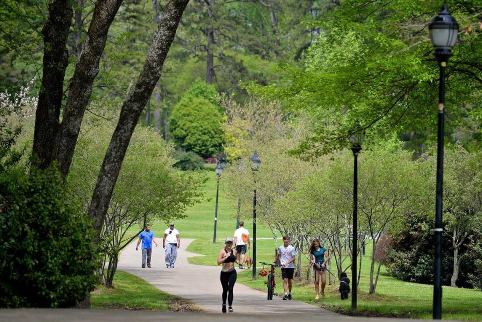 Mecklenburg County residents are still allowed to use the parks, as in here at Freedom Park, but social-distancing is expected. County officials recently closed off parking at the parks, intended to discourage groups from congregating.