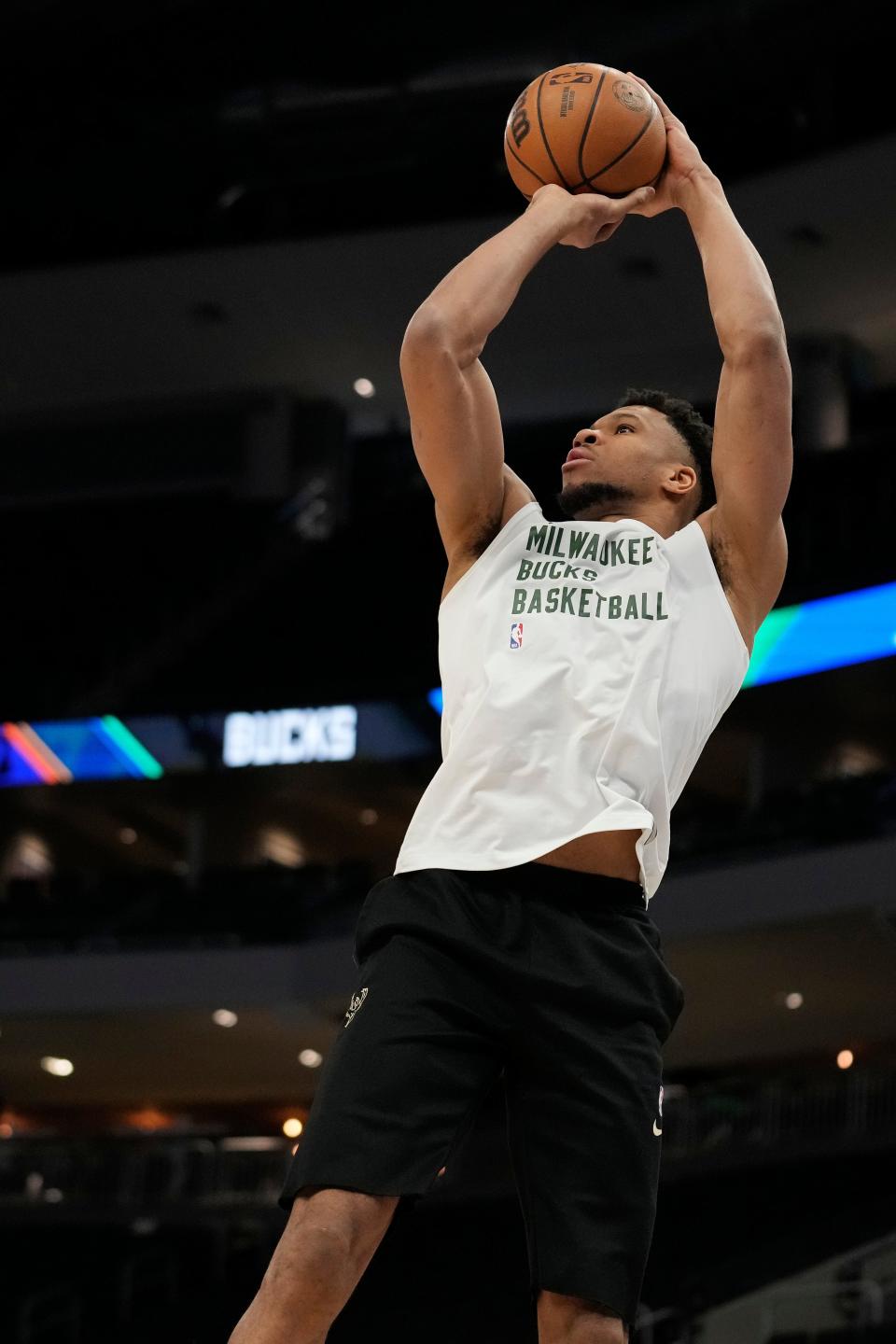 Giannis Antetokounmpo warms up before Milwaukee's game against Phoenix at Fiserv Forum on Sunday. He did not play though.
