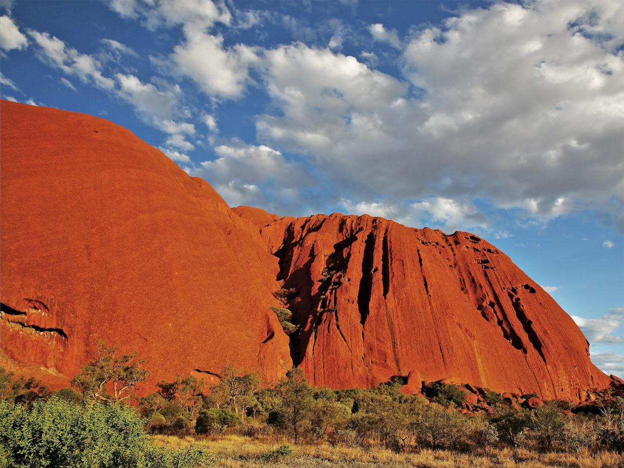 Uluru, formerly Ayers Rock, used to be visited by over 250,000 people each year (Getty Images)