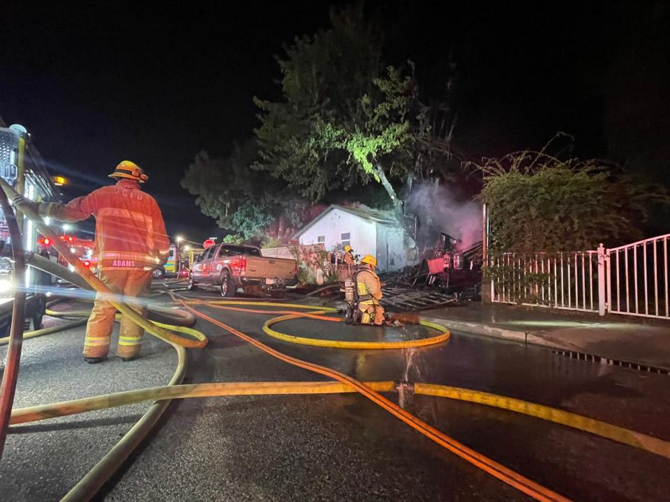 Ventura County firefighters tackle a trailer fire that spread to an attic in Oak View early Tuesday, Aug. 23, 2022.