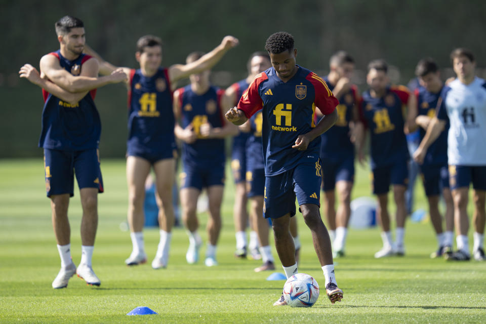 Spain's Ansu Fati works out during a training session at Qatar University, in Doha, Qatar, Tuesday, Nov. 29, 2022. Spain will play its first final match in Group E in the World Cup against Japan on Dec. 1. (AP Photo/Julio Cortez)