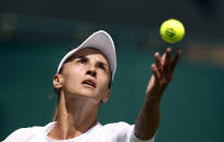 Ukraine's Lesia Tsurenko serves to Britain's Jodie Burrage during a women's singles first round match on day one of the Wimbledon tennis championships in London, Monday, June 27, 2022. (Steve Paston/PA via AP)